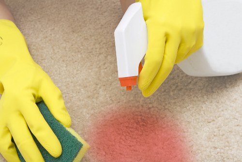 Cleaner wearing PPE during a Docklands property cleaning visit