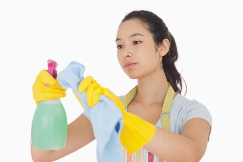 Cleaner preparing a Docklands rental property for move-out inspection